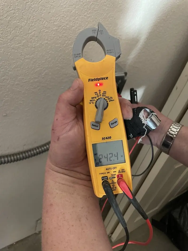 Voltage testing with clamp meter during Electrical Installation Services in Yorkville